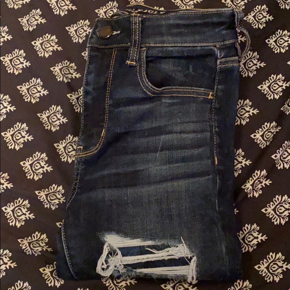 Womens distressed skinny jeans.